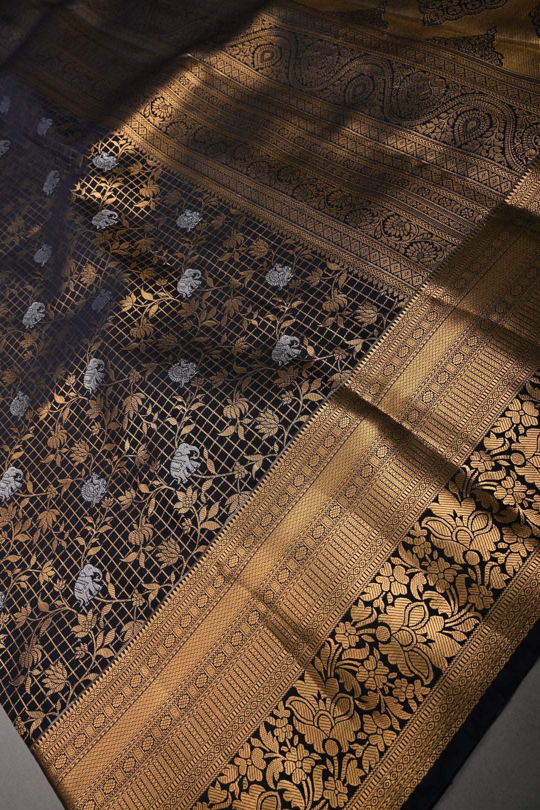 Blackish Blue Zari Checks on Kanjivaram Soft Semi Silk Saree with Floral Jaal-Silver Buttas and Zari Border | SHOBITAM
