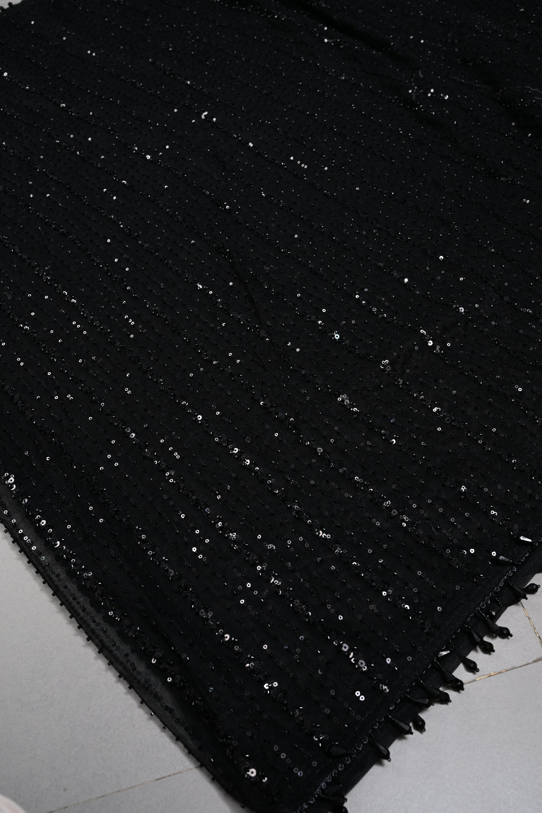 Black Net Saree with Vertical Stripes Embellishments and Dangling Beads Border | SHOBITAM