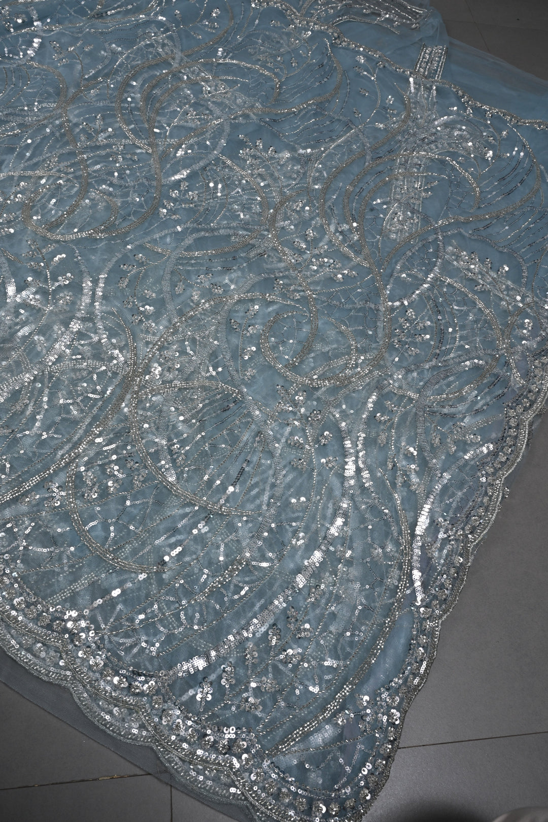 Powder Blue Swirling Design Sequins, Cutdana Embellishment on Net Saree with Scallop Border