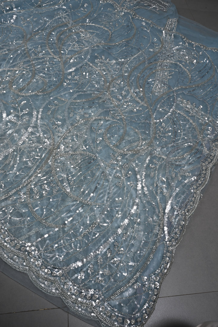 Powder Blue Swirling Design Sequins, Cutdana Embellishment on Net Saree with Scallop Border