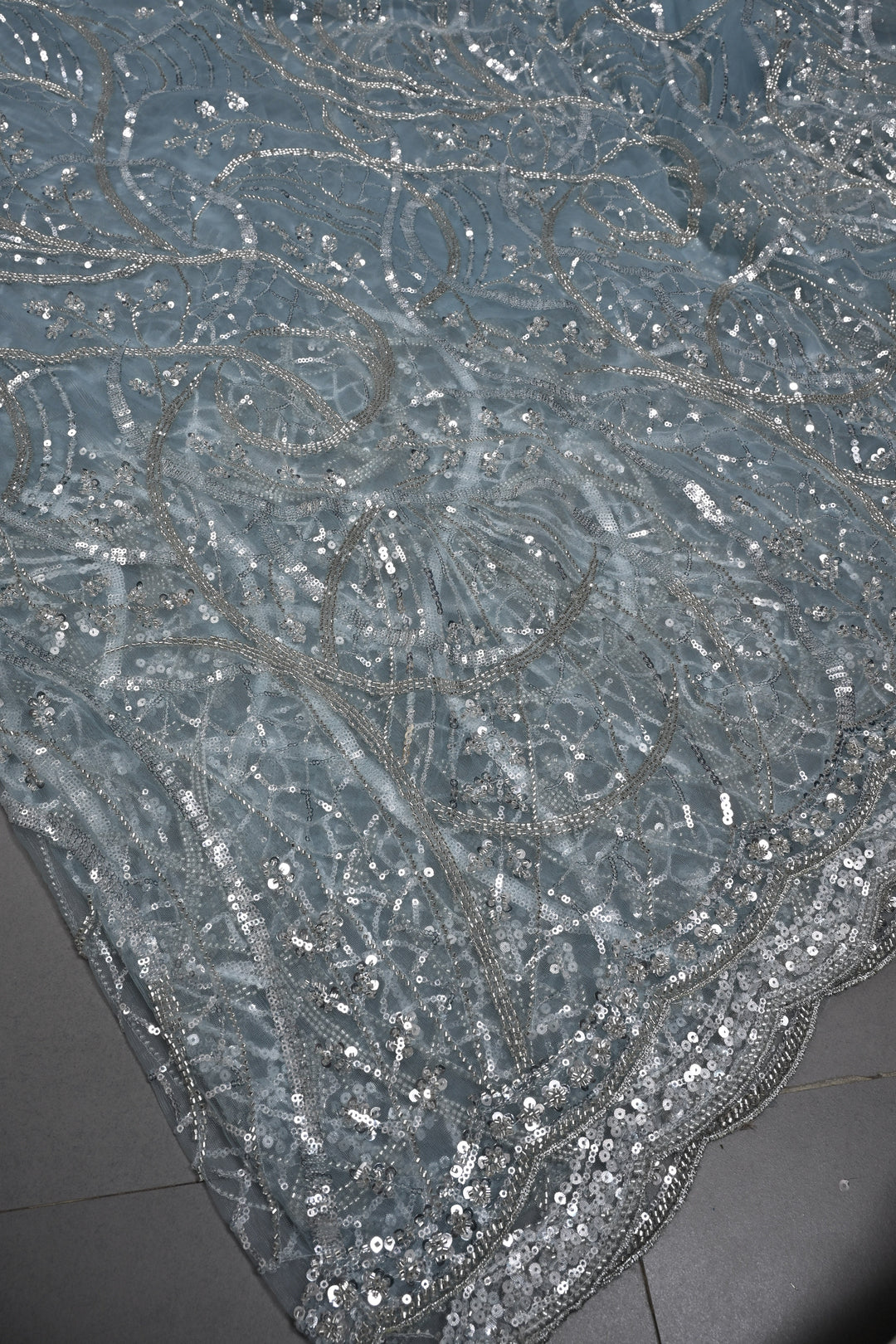 Powder Blue Swirling Design Sequins, Cutdana Embellishment on Net Saree with Scallop Border