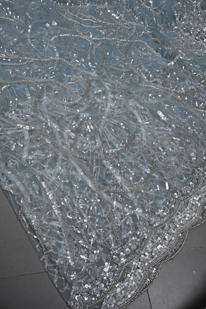 Powder Blue Swirling Design Sequins, Cutdana Embellishment on Net Saree with Scallop Border