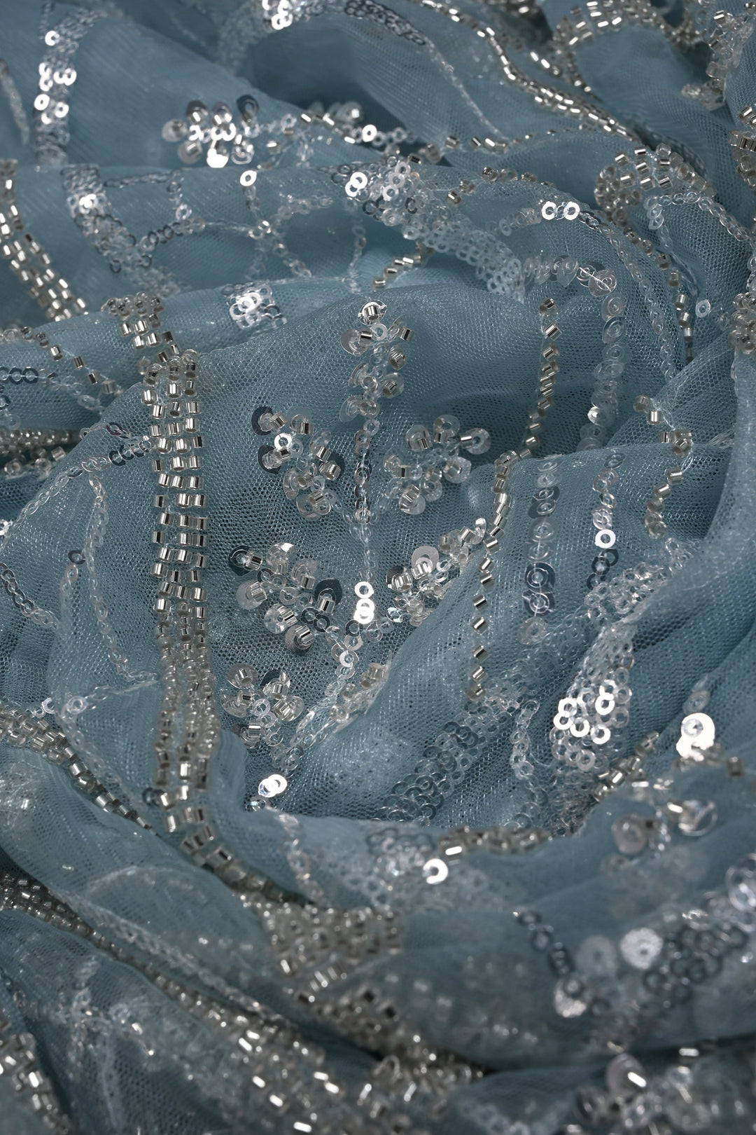 Powder Blue Swirling Design Sequins, Cutdana Embellishment on Net Saree with Scallop Border