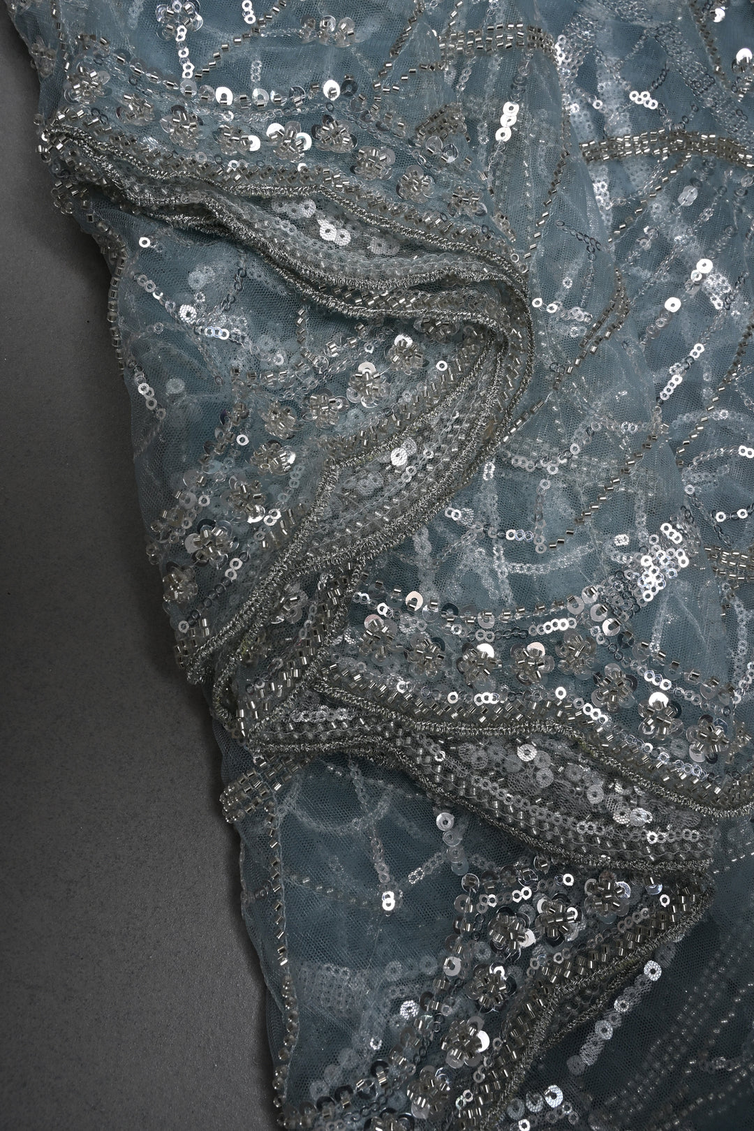 Powder Blue Swirling Design Sequins, Cutdana Embellishment on Net Saree with Scallop Border