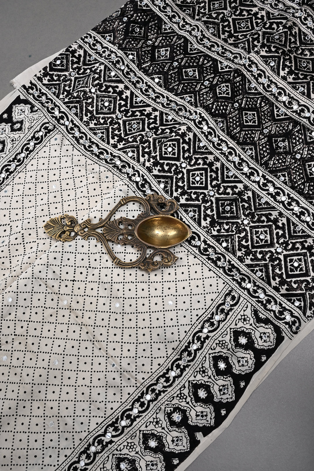 Tikki handwork on Ajrakh Modal Silk Saree in Ivory SHOBITAM