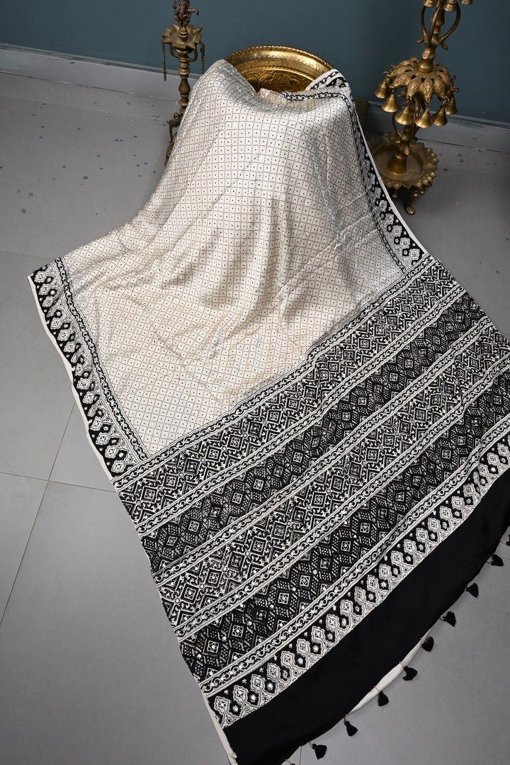 Tikki handwork on Ajrakh Modal Silk Saree in Ivory SHOBITAM