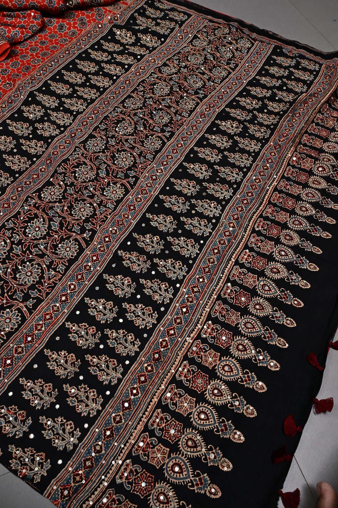 Handwork Ajrakh Saree with Tikki and Aari work on Red Black Ajrakh on Modal Silk  | SHOBITAM