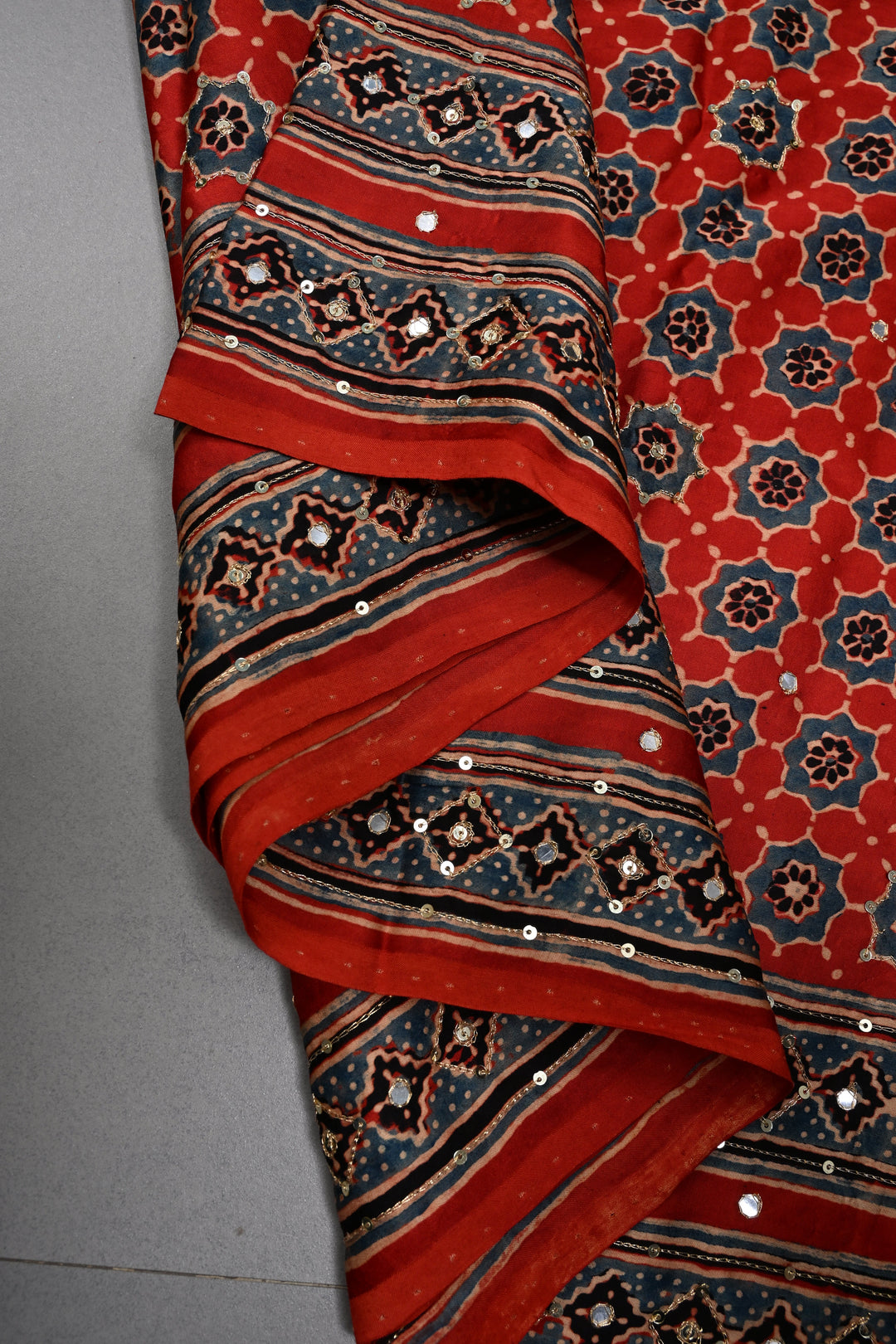 Handwork Ajrakh Saree with Tikki and Aari work on Red Black Ajrakh on Modal Silk  | SHOBITAM