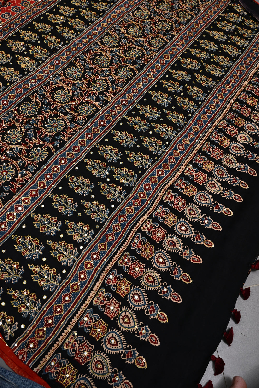 Handwork Ajrakh Saree with Tikki and Aari work on Striking Red Black Ajrakh on Modal Silk  | SHOBITAM