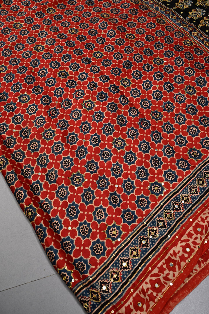 Handwork Ajrakh Saree with Tikki and Aari work on Striking Red Black Ajrakh on Modal Silk  | SHOBITAM