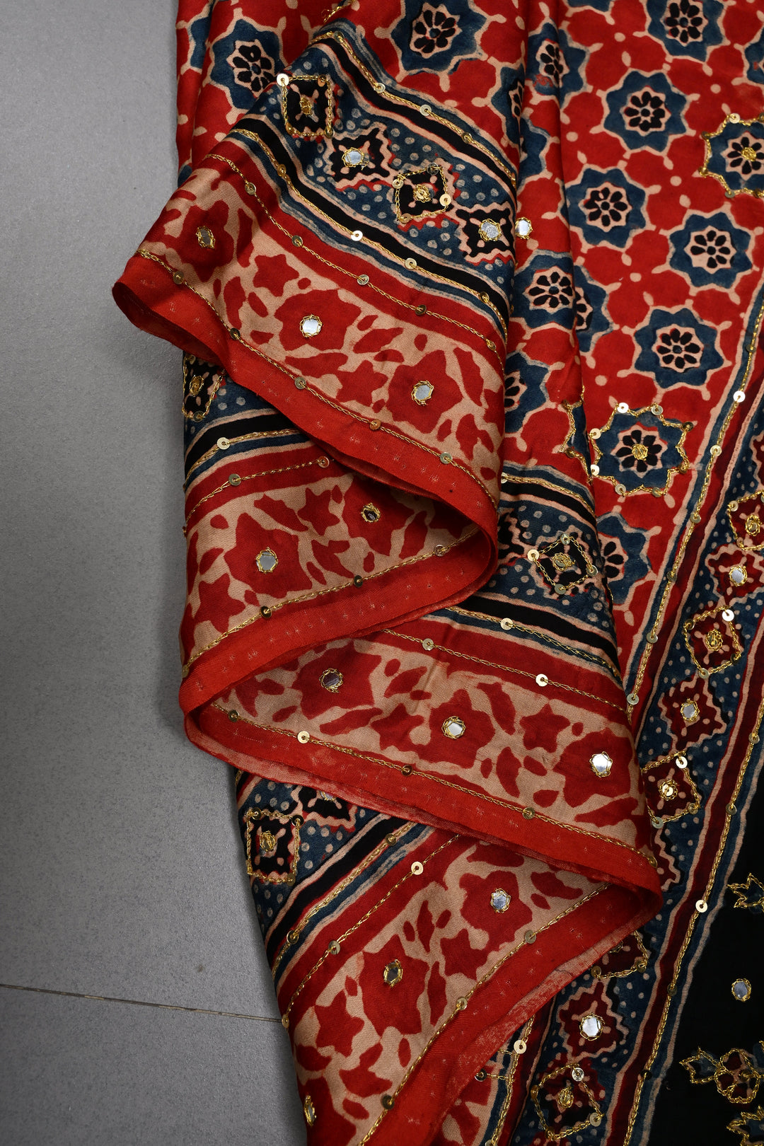 Handwork Ajrakh Saree with Tikki and Aari work on Striking Red Black Ajrakh on Modal Silk  | SHOBITAM