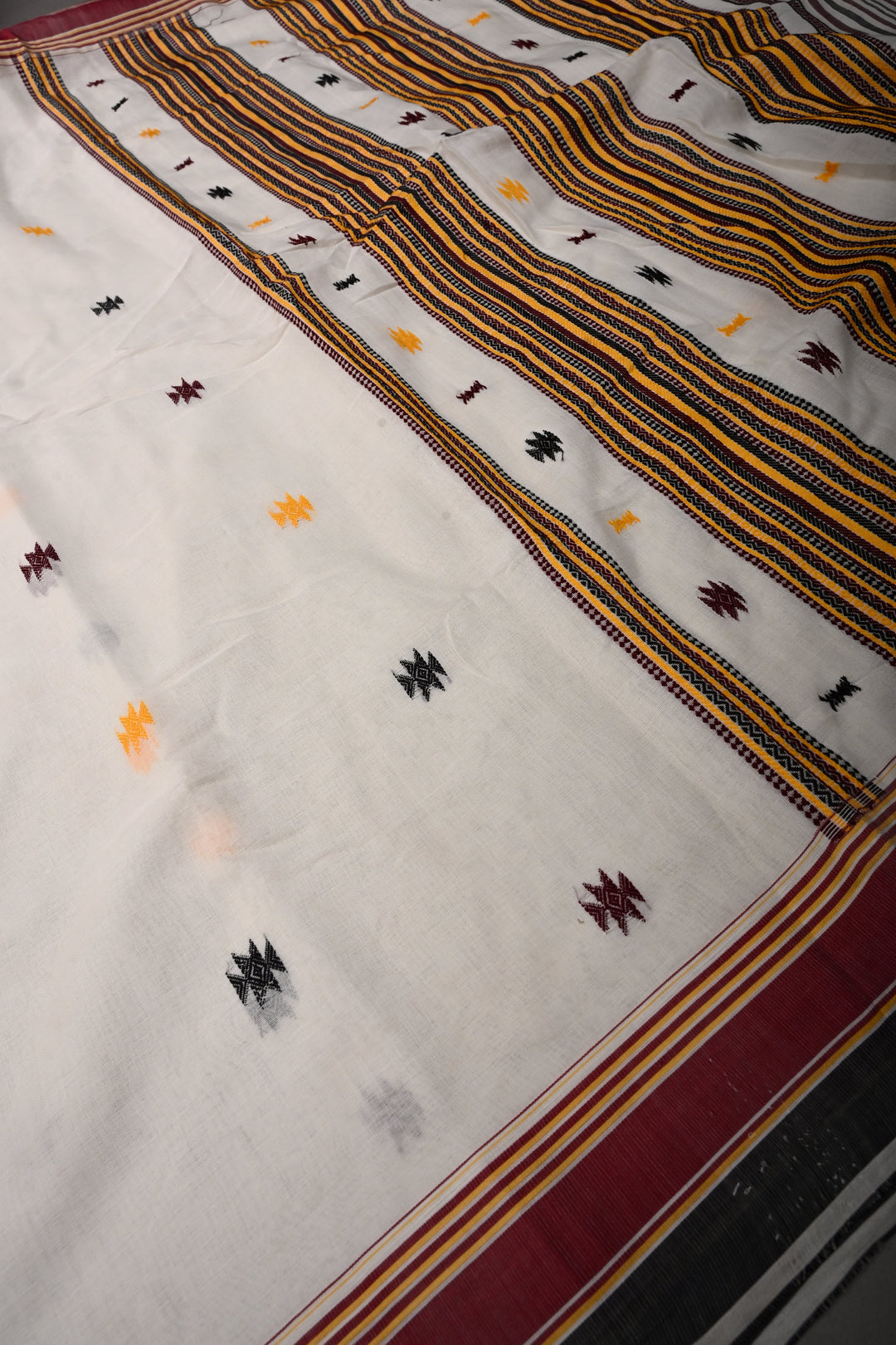 Ivory Bhujodi Kala Cotton Saree with Thread Buttas and Contrast Border | SHOBITAM