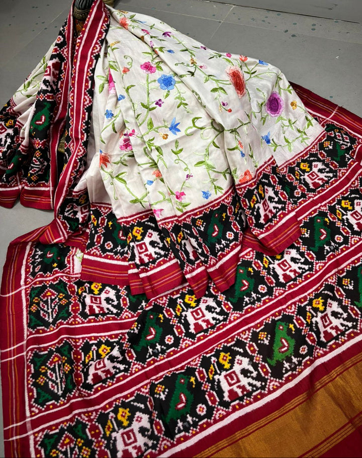 Authentic Double Ikkat Patan Patola Handwoven Saree in Off White with Parsi Gara Hand Embroidery and Patli Pallu   | SILK MARK CERTIFIED | SHOBITAM