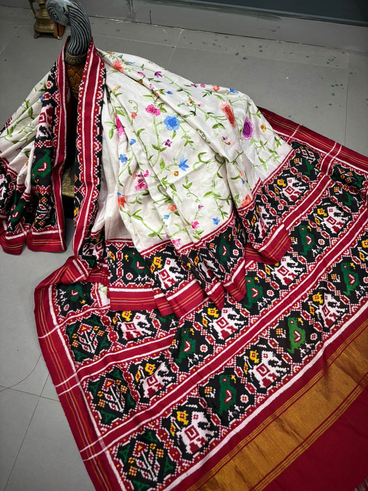 Authentic Double Ikkat Patan Patola Handwoven Saree in Off White with Parsi Gara Hand Embroidery and Patli Pallu   | SILK MARK CERTIFIED | SHOBITAM