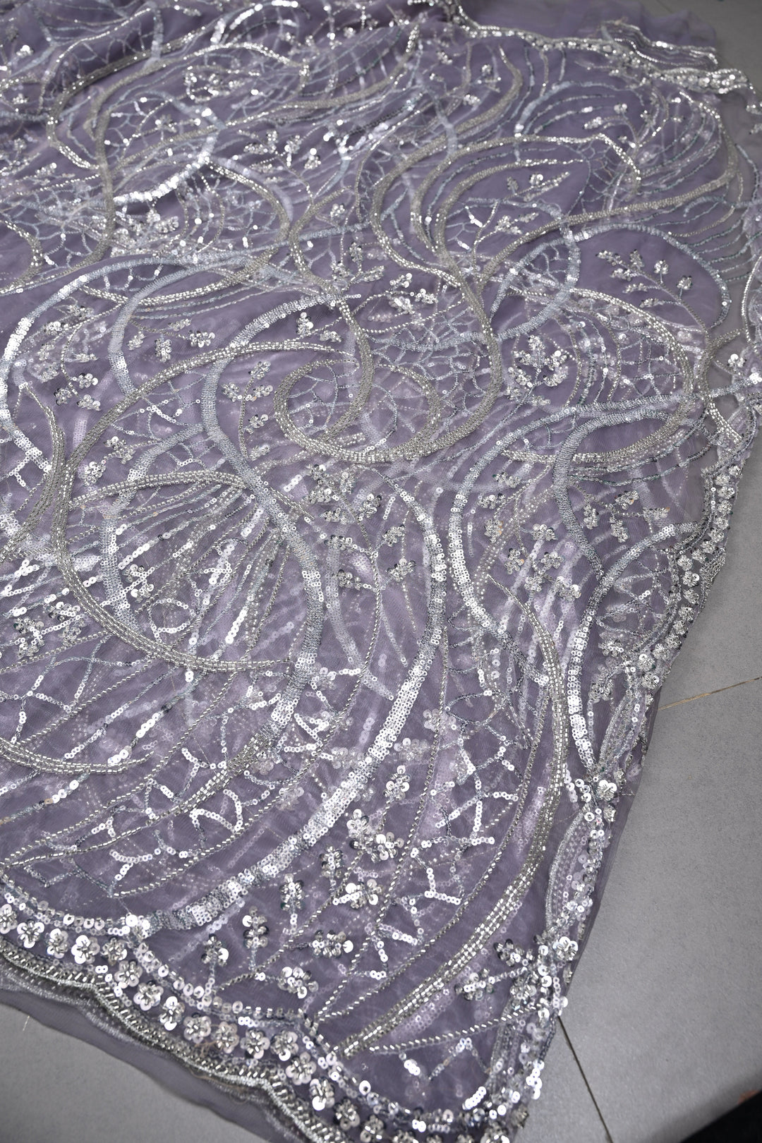 Mauve Swirling Design Sequins, Cutdana Embellishment on Net Saree with Scallop Border