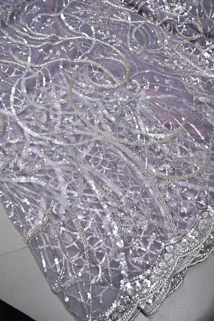 Mauve Swirling Design Sequins, Cutdana Embellishment on Net Saree with Scallop Border