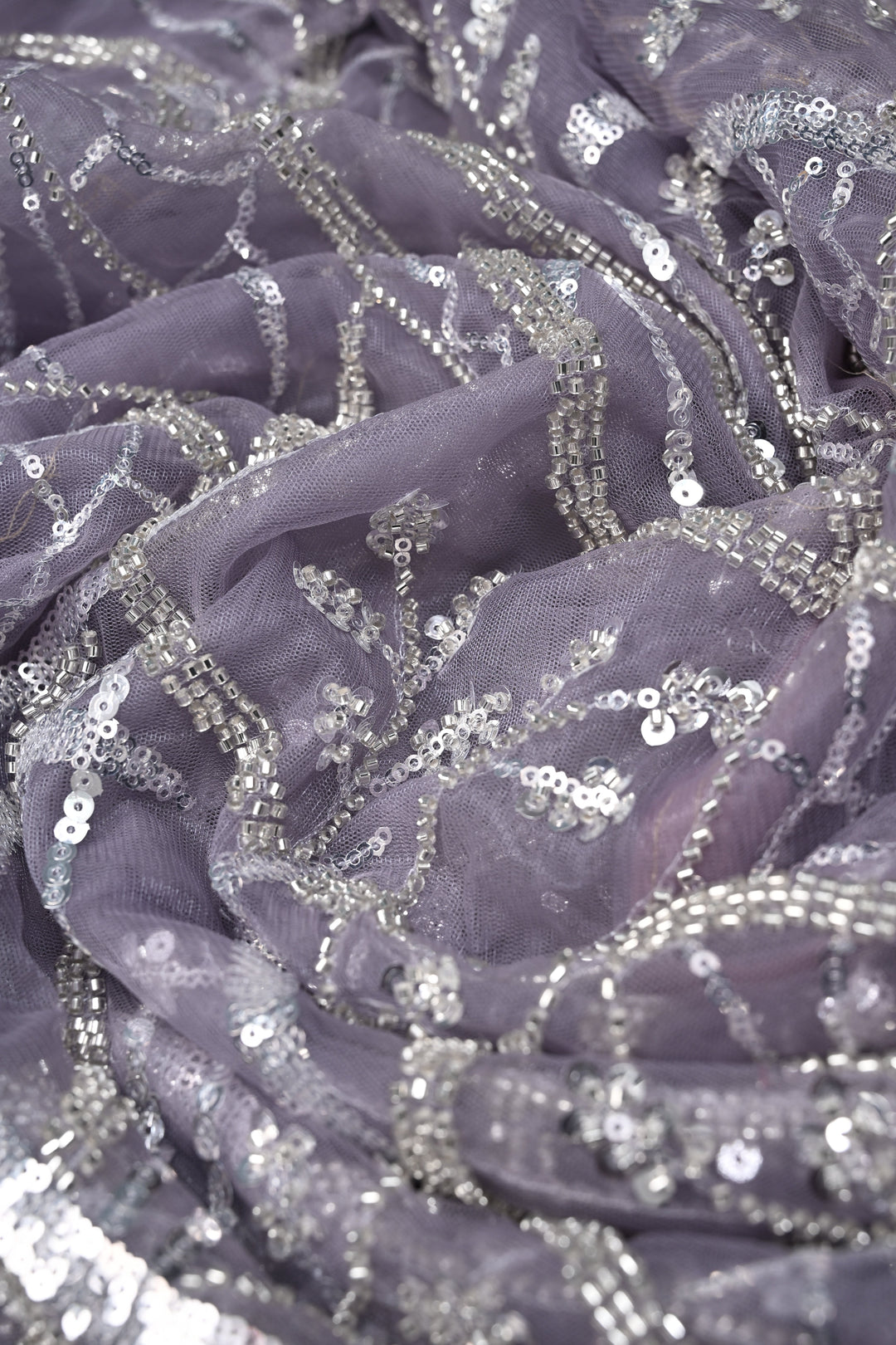 Mauve Swirling Design Sequins, Cutdana Embellishment on Net Saree with Scallop Border