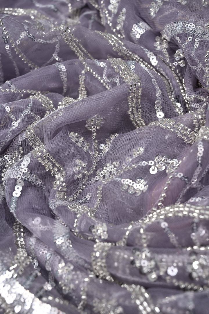 Mauve Swirling Design Sequins, Cutdana Embellishment on Net Saree with Scallop Border