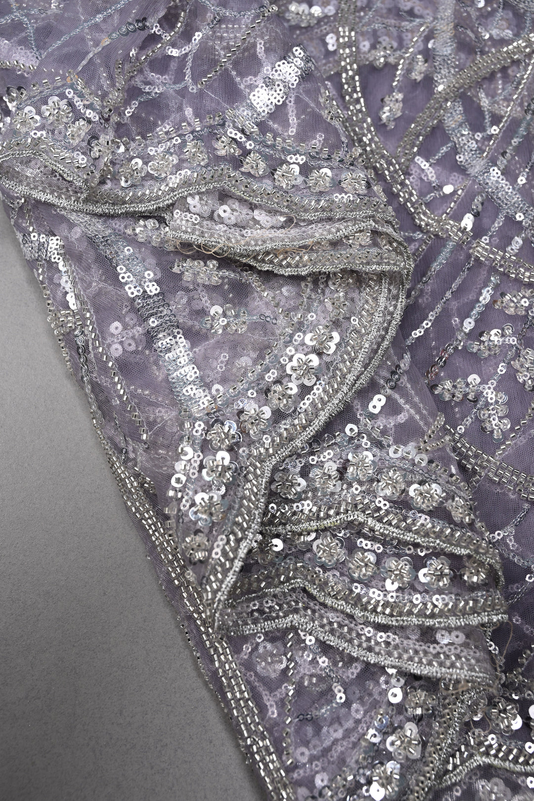 Mauve Swirling Design Sequins, Cutdana Embellishment on Net Saree with Scallop Border