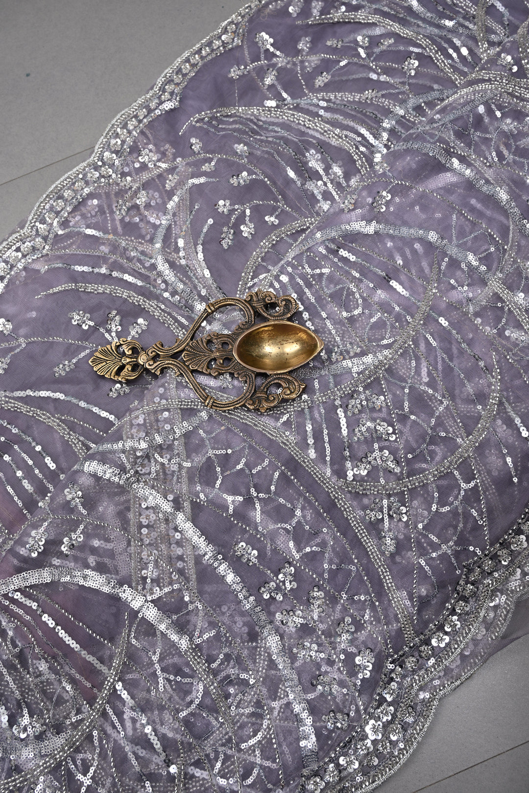 Mauve Swirling Design Sequins, Cutdana Embellishment on Net Saree with Scallop Border