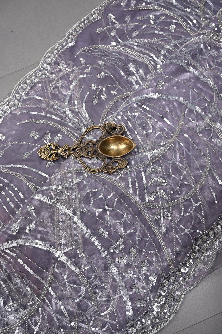 Mauve Swirling Design Sequins, Cutdana Embellishment on Net Saree with Scallop Border