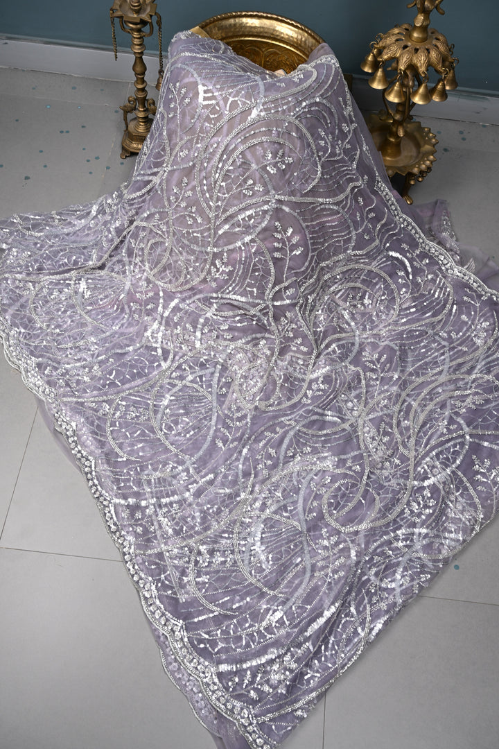 Mauve Swirling Design Sequins, Cutdana Embellishment on Net Saree with Scallop Border