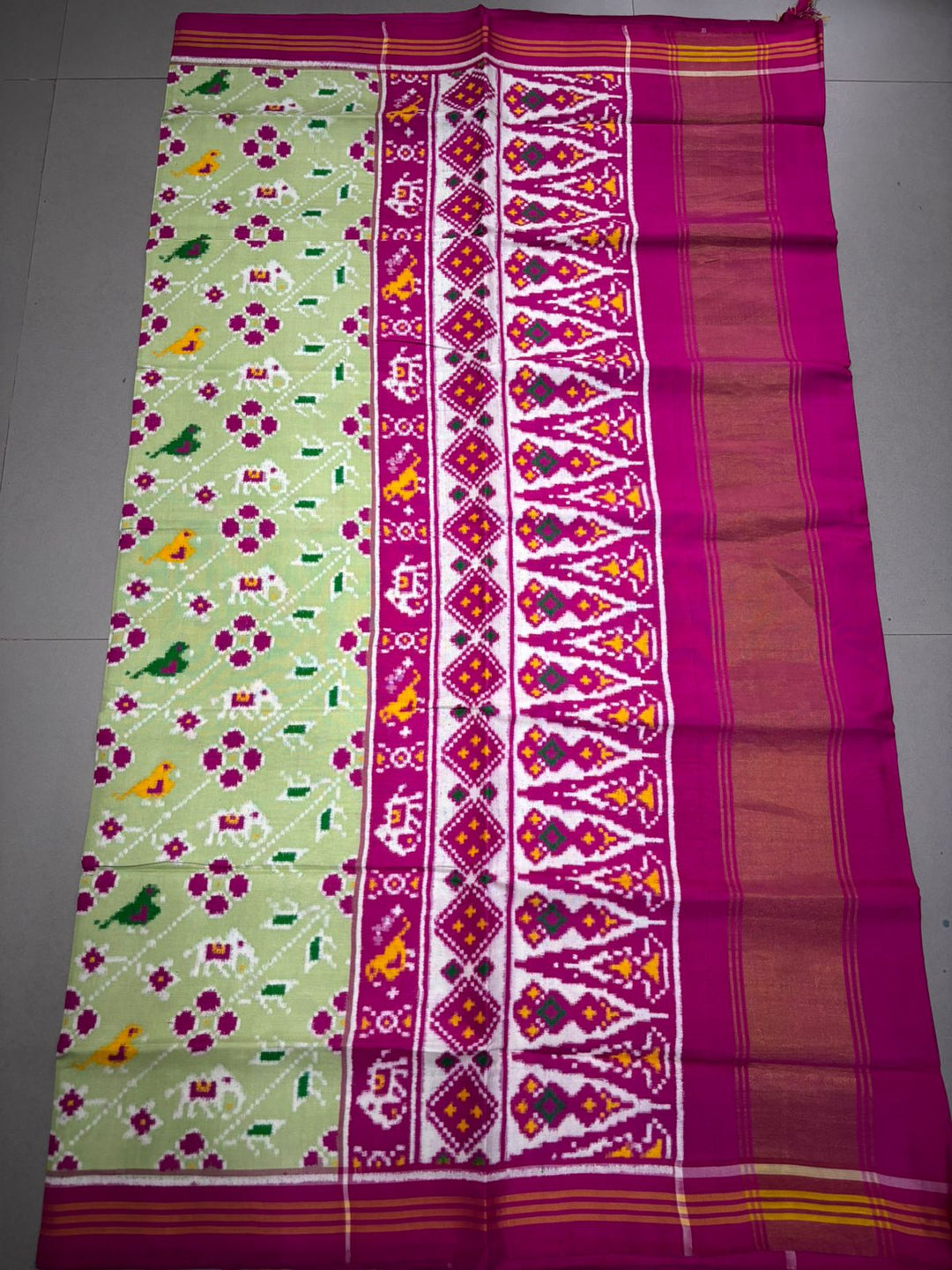 Authentic Double Ikkat Patan Patola Pure Silk Handwoven Patli Pallu Saree in Light Pista Green with Leheria Design and Pink Border | SILK MARK CERTIFIED | SHOBITAM