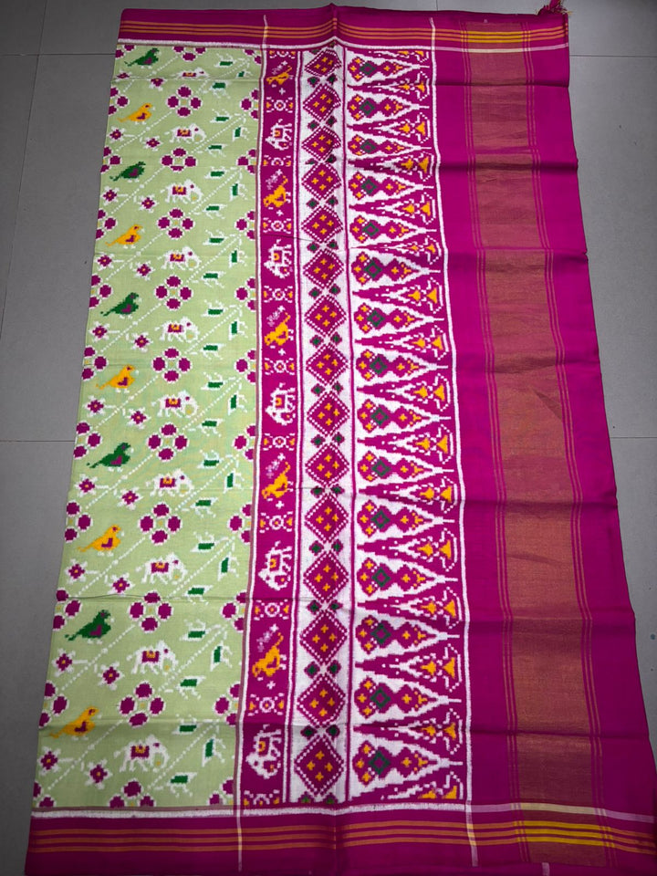 Authentic Double Ikkat Patan Patola Pure Silk Handwoven Patli Pallu Saree in Light Pista Green with Leheria Design and Pink Border | SILK MARK CERTIFIED | SHOBITAM