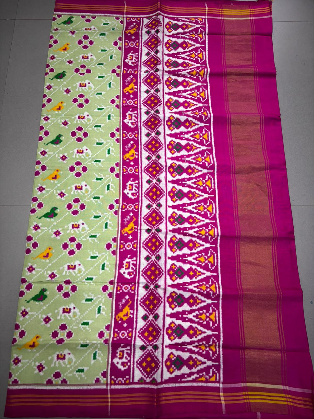 Authentic Double Ikkat Patan Patola Pure Silk Handwoven Patli Pallu Saree in Light Pista Green with Leheria Design and Pink Border | SILK MARK CERTIFIED | SHOBITAM