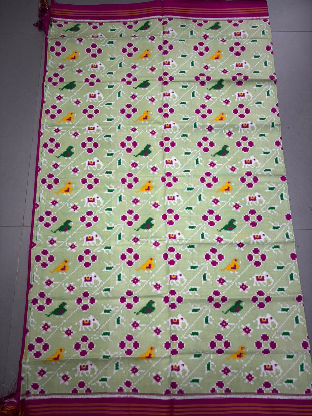 Authentic Double Ikkat Patan Patola Pure Silk Handwoven Patli Pallu Saree in Light Pista Green with Leheria Design and Pink Border | SILK MARK CERTIFIED | SHOBITAM