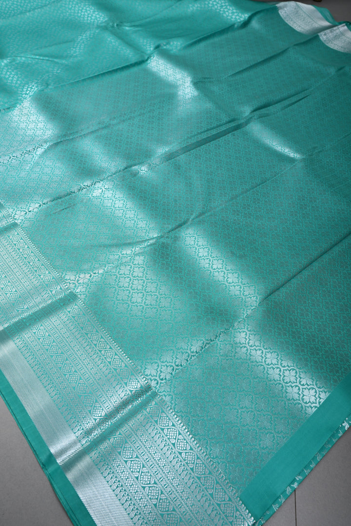 Sea Green Kanjivaram Soft Semi Silk Saree with Floral Brocade and Silver Zari Border | SHOBITAM