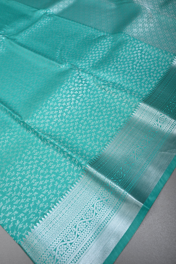 Sea Green Kanjivaram Soft Semi Silk Saree with Floral Brocade and Silver Zari Border | SHOBITAM
