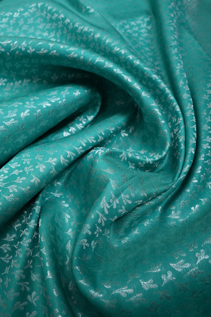 Sea Green Kanjivaram Soft Semi Silk Saree with Floral Brocade and Silver Zari Border | SHOBITAM
