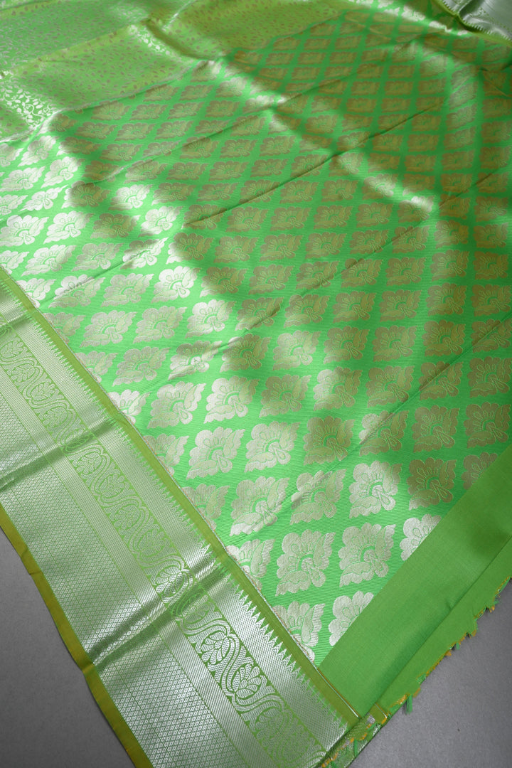 Parrot Green Kanjivaram Soft Semi Silk Saree with Floral Brocade Jaal and Silver Zari Border | SHOBITAM