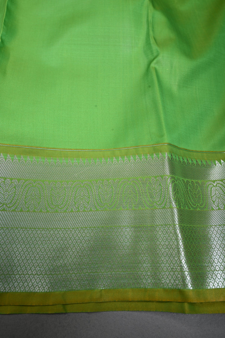 Parrot Green Kanjivaram Soft Semi Silk Saree with Floral Brocade Jaal and Silver Zari Border | SHOBITAM