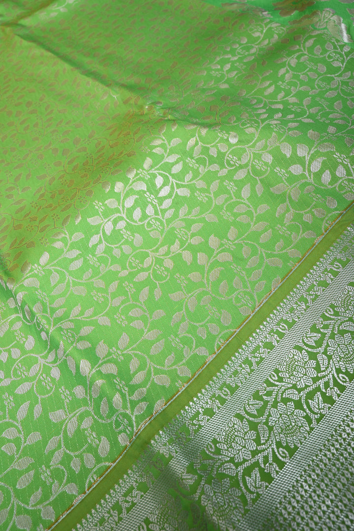 Parrot Green Kanjivaram Soft Semi Silk Saree with Floral Brocade Jaal and Silver Zari Border | SHOBITAM