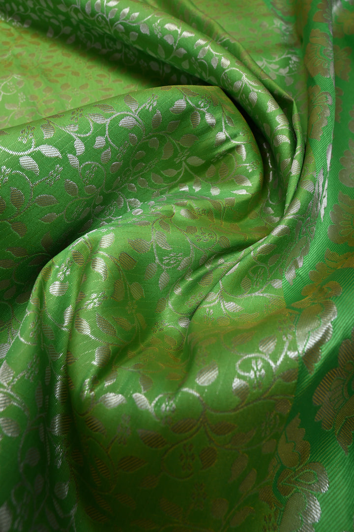 Parrot Green Kanjivaram Soft Semi Silk Saree with Floral Brocade Jaal and Silver Zari Border | SHOBITAM