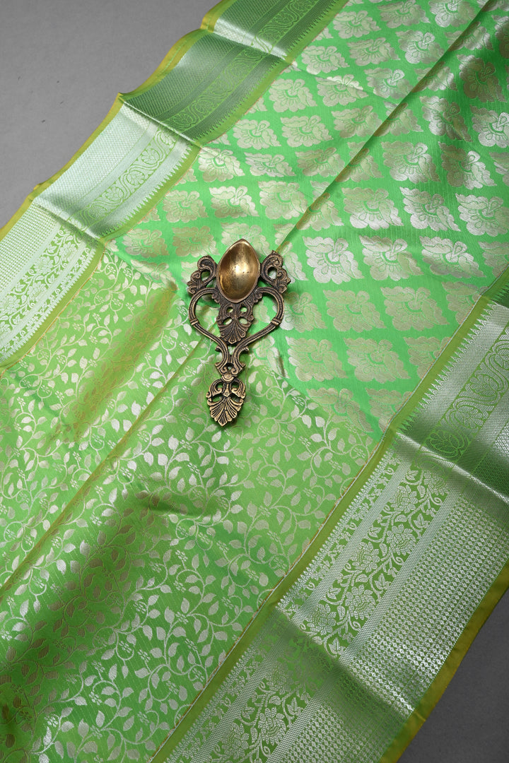 Parrot Green Kanjivaram Soft Semi Silk Saree with Floral Brocade Jaal and Silver Zari Border | SHOBITAM