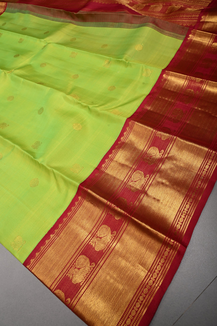 Parrot Green korvai Kanjivaram Pure Silk Saree with Zari Buttas and Contrast Zari Border | SILK MARK CERTIFIED | SHOBITAM