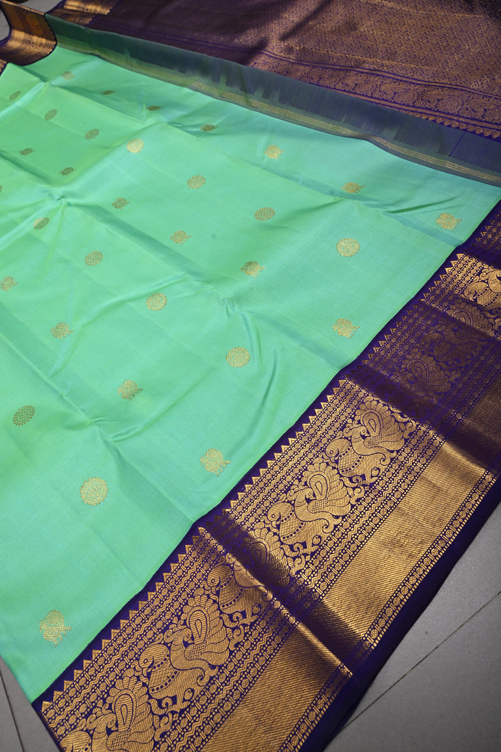 Sea Green Dual tone Korvai Kanjivaram Pure Silk Saree with Zari Buttas and Contrast Zari Border | SILK MARK CERTIFIED | SHOBITAM