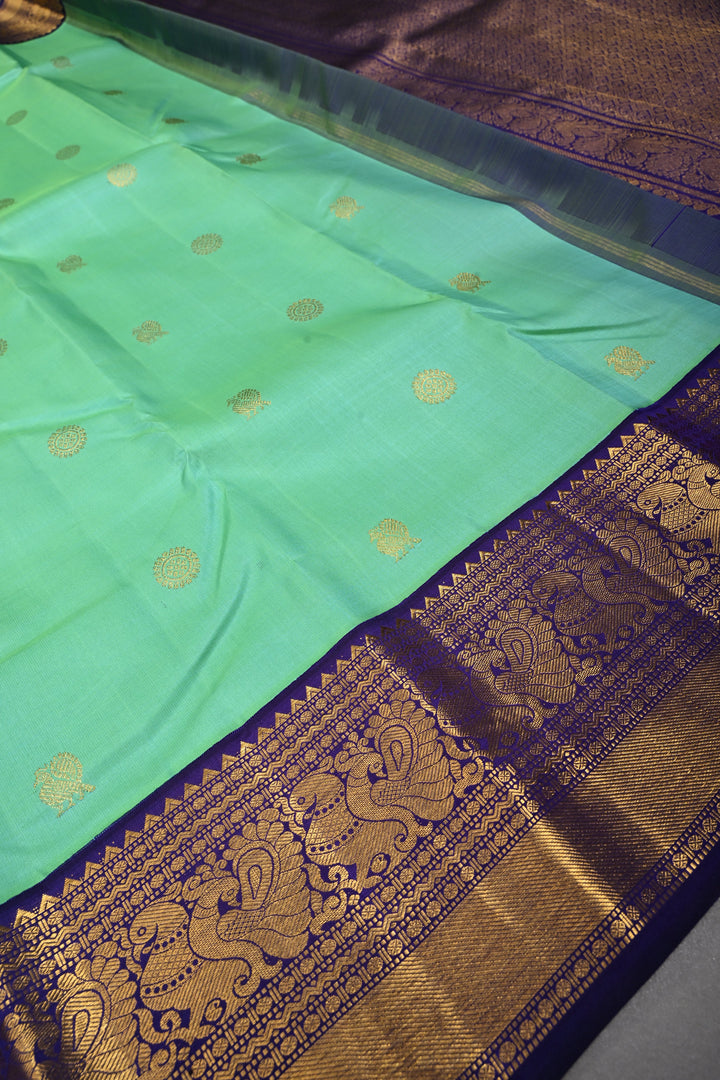 Sea Green Dual tone Korvai Kanjivaram Pure Silk Saree with Zari Buttas and Contrast Zari Border | SILK MARK CERTIFIED | SHOBITAM