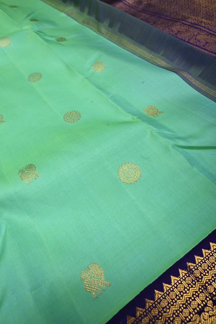 Sea Green Dual tone Korvai Kanjivaram Pure Silk Saree with Zari Buttas and Contrast Zari Border | SILK MARK CERTIFIED | SHOBITAM