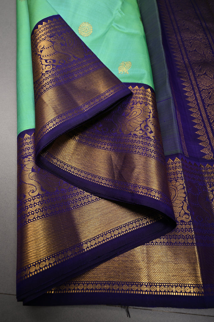 Sea Green Dual tone Korvai Kanjivaram Pure Silk Saree with Zari Buttas and Contrast Zari Border | SILK MARK CERTIFIED | SHOBITAM