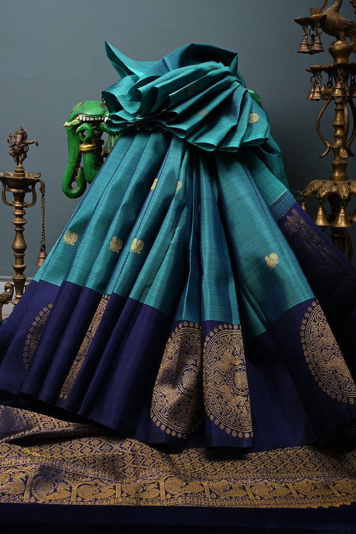 Aegean Blue Kanjivaram Pure Silk Saree with Zari Buttas and One Side Distinct Vanasingaram Mandala Motifs on Border | SILK MARK CERTIFIED | SHOBITAM