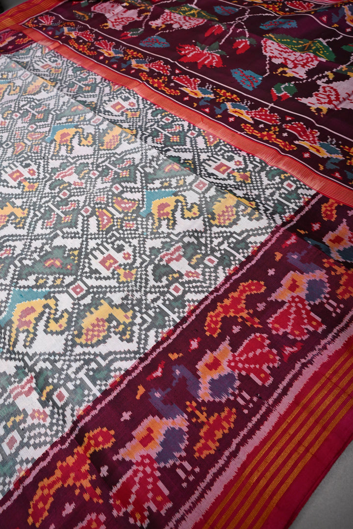 Authentic Patan Patola Pure Silk Handwoven Single Ikkat saree in Ivory with Intricate motifs and contrast borders | SILK MARK CERTIFIED | SHOBITAM
