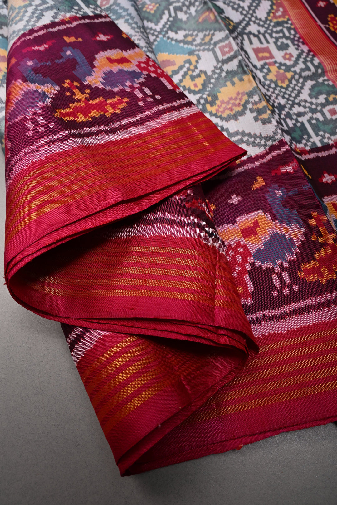 Authentic Patan Patola Pure Silk Handwoven Single Ikkat saree in Ivory with Intricate motifs and contrast borders | SILK MARK CERTIFIED | SHOBITAM