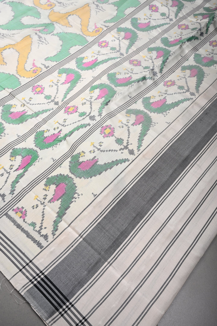 Authentic Patan Patola Single Ikkat Handwoven Pure Silk Saree in Pristine Chalk White with intricate motifs | SILK MARK CERTIFIED | SHOBITAM
