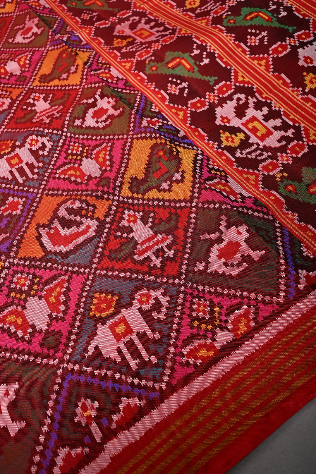 Maroon-Red Patan Patola Single Ikkat handwoven Pure Silk Saree with Geometric Motifs and Minimal Border  | SILK MARK CERTIFIED | SHOBITAM