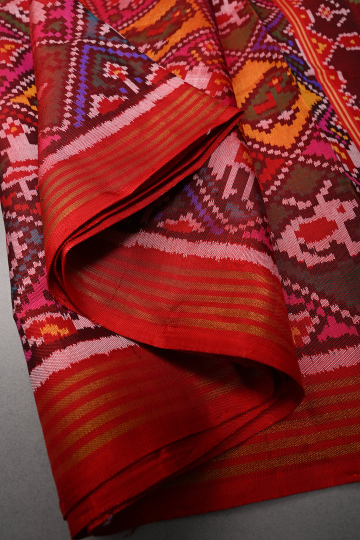 Maroon-Red Patan Patola Single Ikkat handwoven Pure Silk Saree with Geometric Motifs and Minimal Border  | SILK MARK CERTIFIED | SHOBITAM