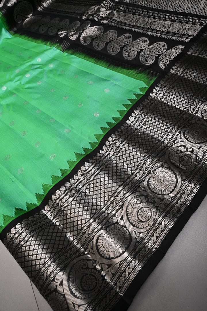 Sea Green Pure Gadwal Silk Saree with Silver Buttas and Contrast Black Zari Border| SILK MARK CERTIFIED | SHOBITAM